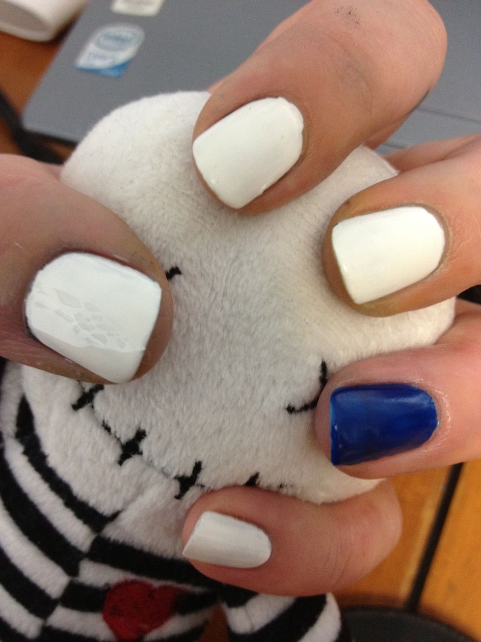 Do white base coat on all nails but one. Paint the last one blue:)