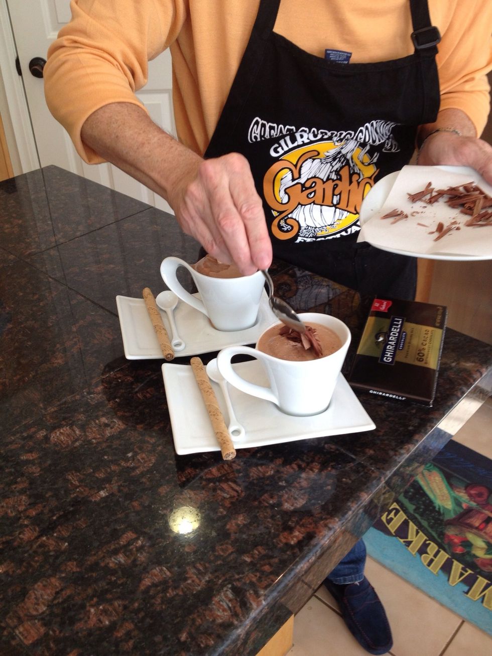 Dollop a generous spoonful of whipped cream on top and garnish with chocolate shavings.