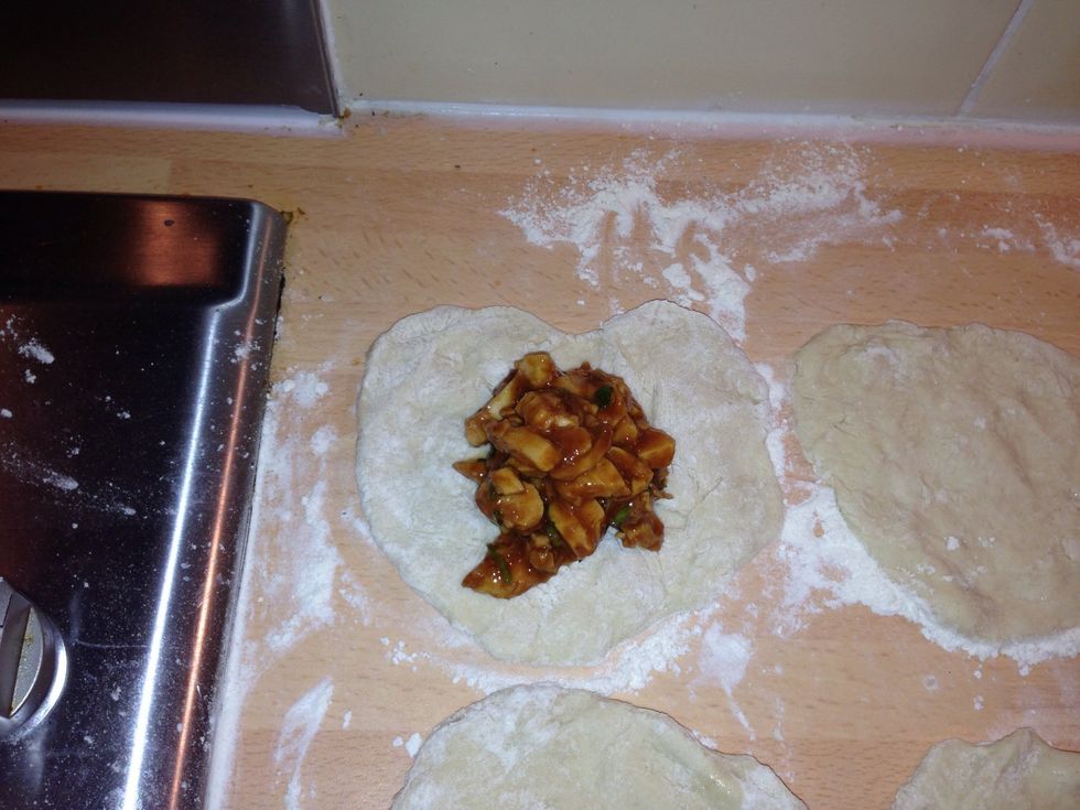 Dollop!!! Spoon the chicken mix into the centre of the dough circle.