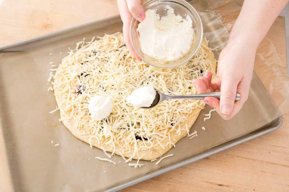 Dollop the ricotta over the pizza.