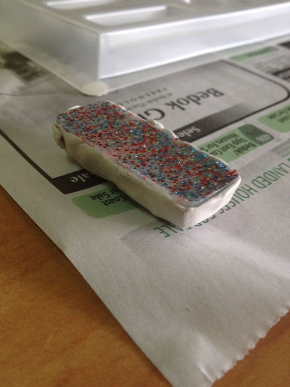 Doming creates a shiny back. You may choose to omit this if you're not particular. Cover the front and sides with Bluetac to protect in case of leakage from the top when resin is poured.