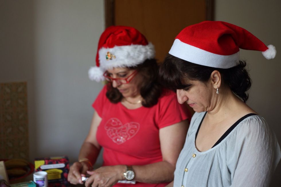 Don't be fooled by their hard working, deep involved intense look. Most of the walnuts ended up in their mouths than in the Ambrosia. Did you wash your hands??