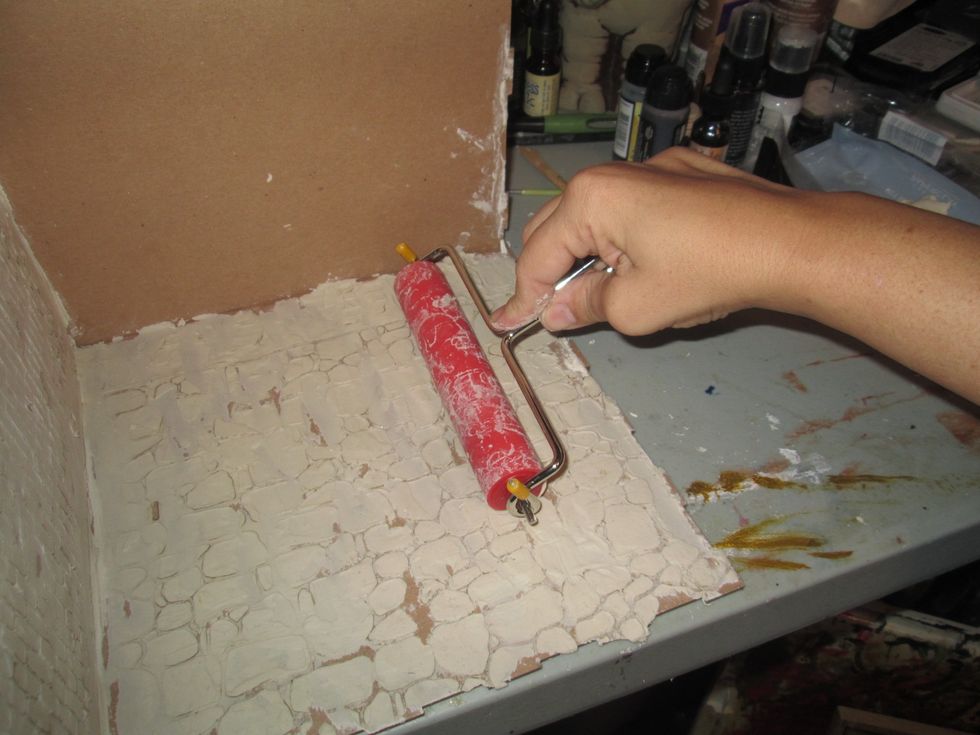 Don't do this! The moisture from the paper clay warps the chipboard and makes it difficult to put together.