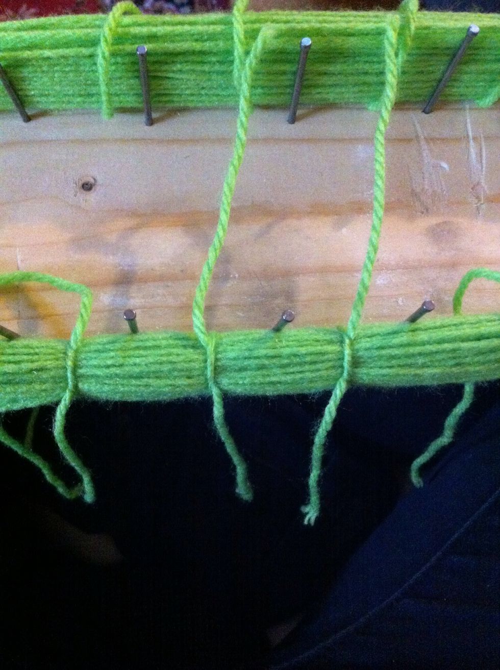 Don't double knot them so they are unable to knot further or loosen. They are still taught around the nails and wool will fall to pieces when cut up.