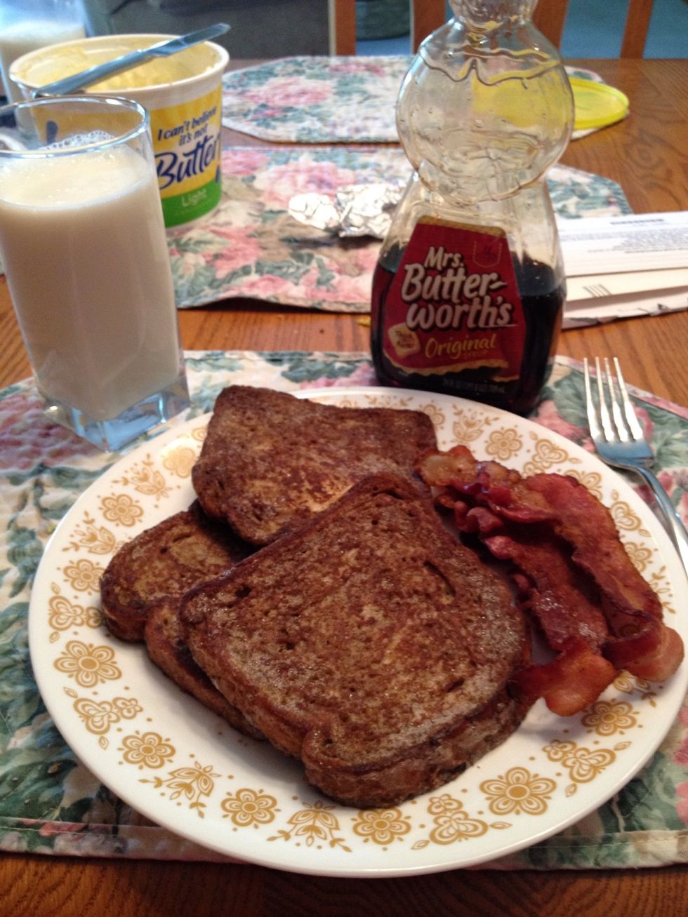 Don't forget butter and syrup for on top! A glass of milk and the bacon from earlier make this breakfast complete! Enjoy!