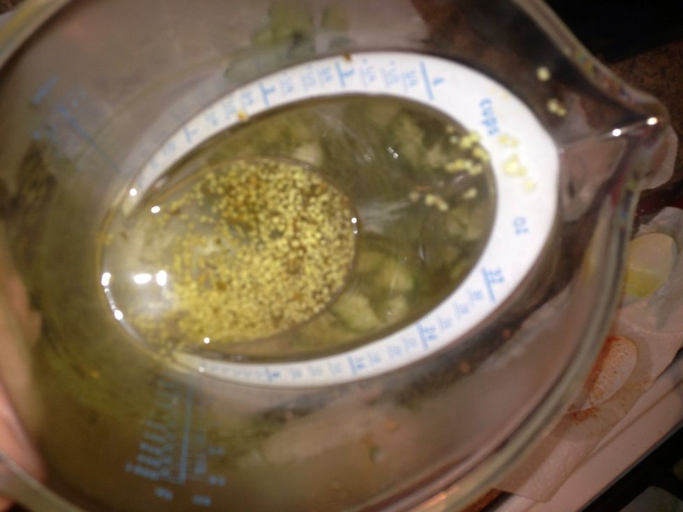 Don't forget the good stuff, use a spoon and try to evenly distribute the solid seasoning into each jar.