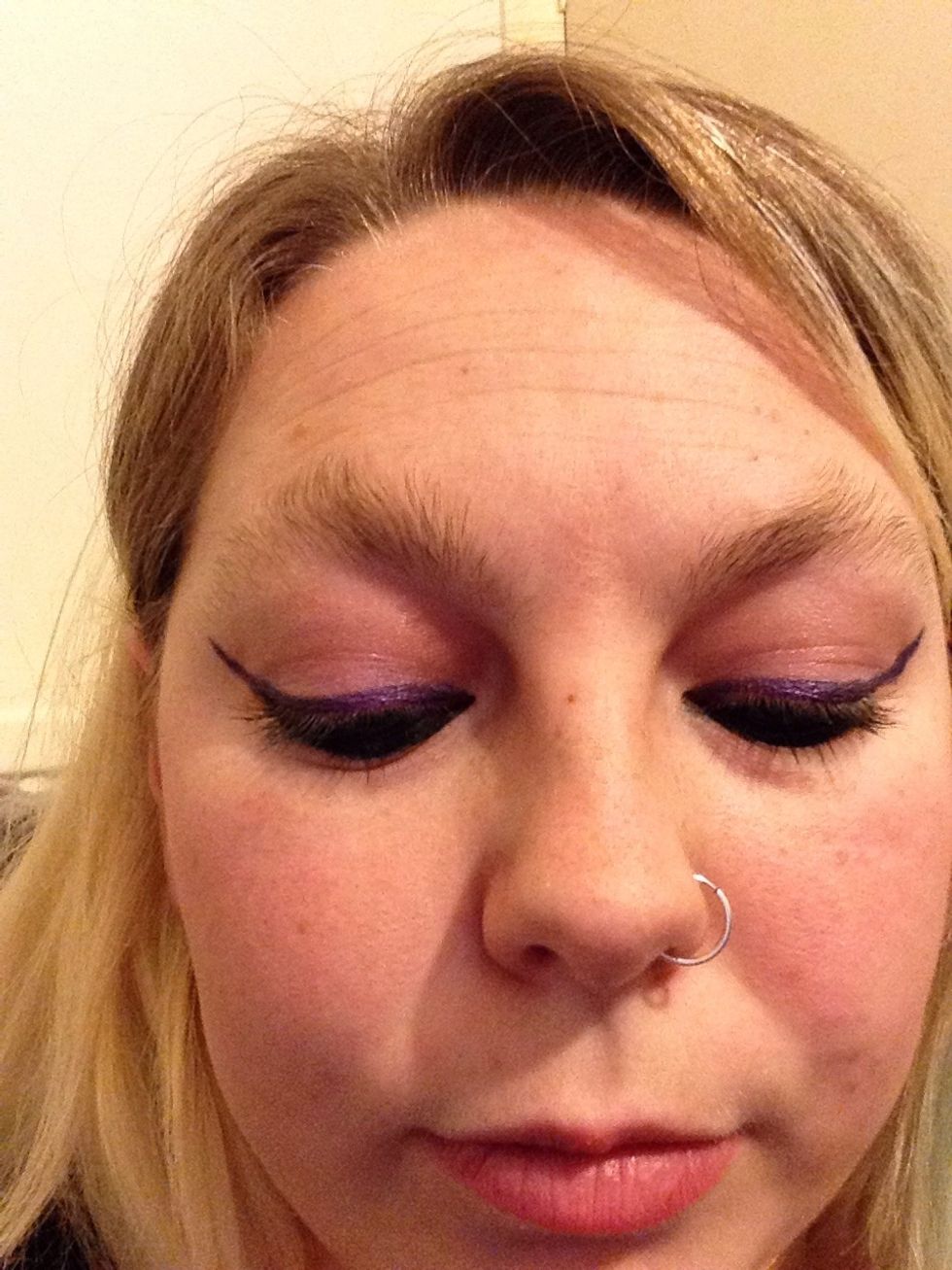 Don't forget to apply mascara to the top of your lashes for a through look.