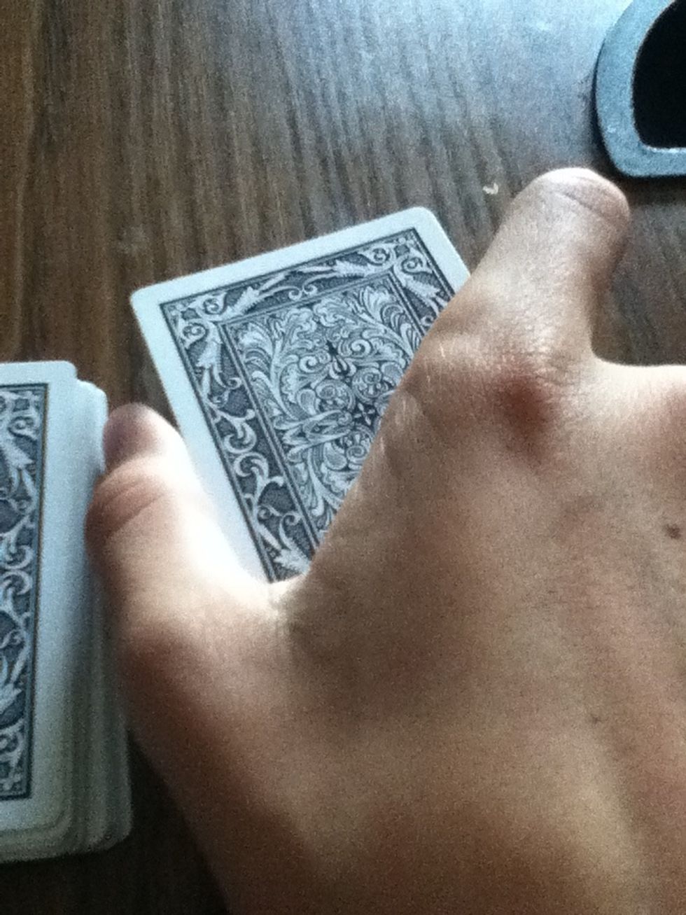 Don't let the spectator(s) see the ledge. So as you set it down put your hand like this and pick the deck up.