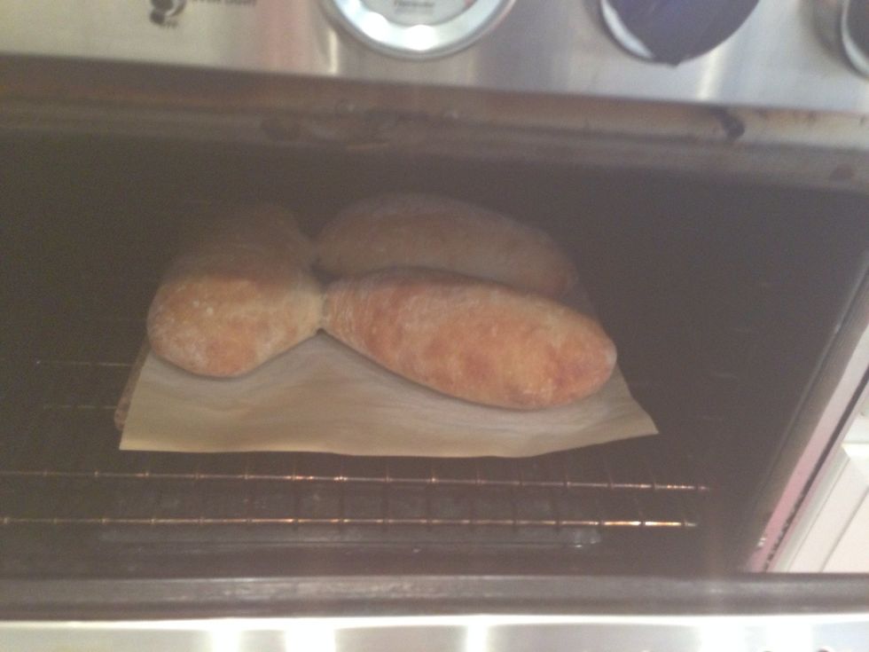 Don't open the oven! For at least 20 minutes. Then you can, but put on those goggles because you're going to get a face-full of steam. If the loaves are attached, cut them apart with a long knife.