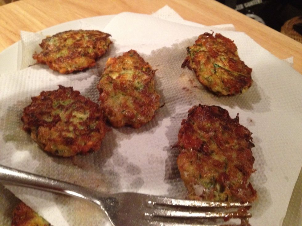 Don't overcrowd them. Keep cooking them in batches and adding them to your paper layered plate. Add more kitchen roll on top and press gently with your hand to get rid of as much oil as possible.