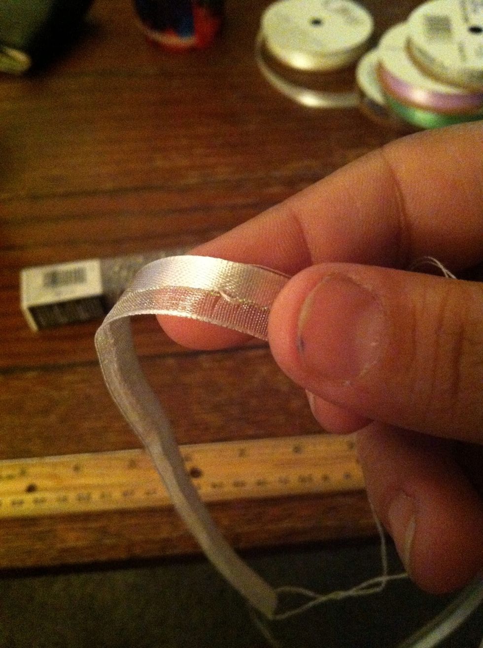 **Don't pull the needle through all the way** Reinsert the needle about a millimeter down, going towards the long end.