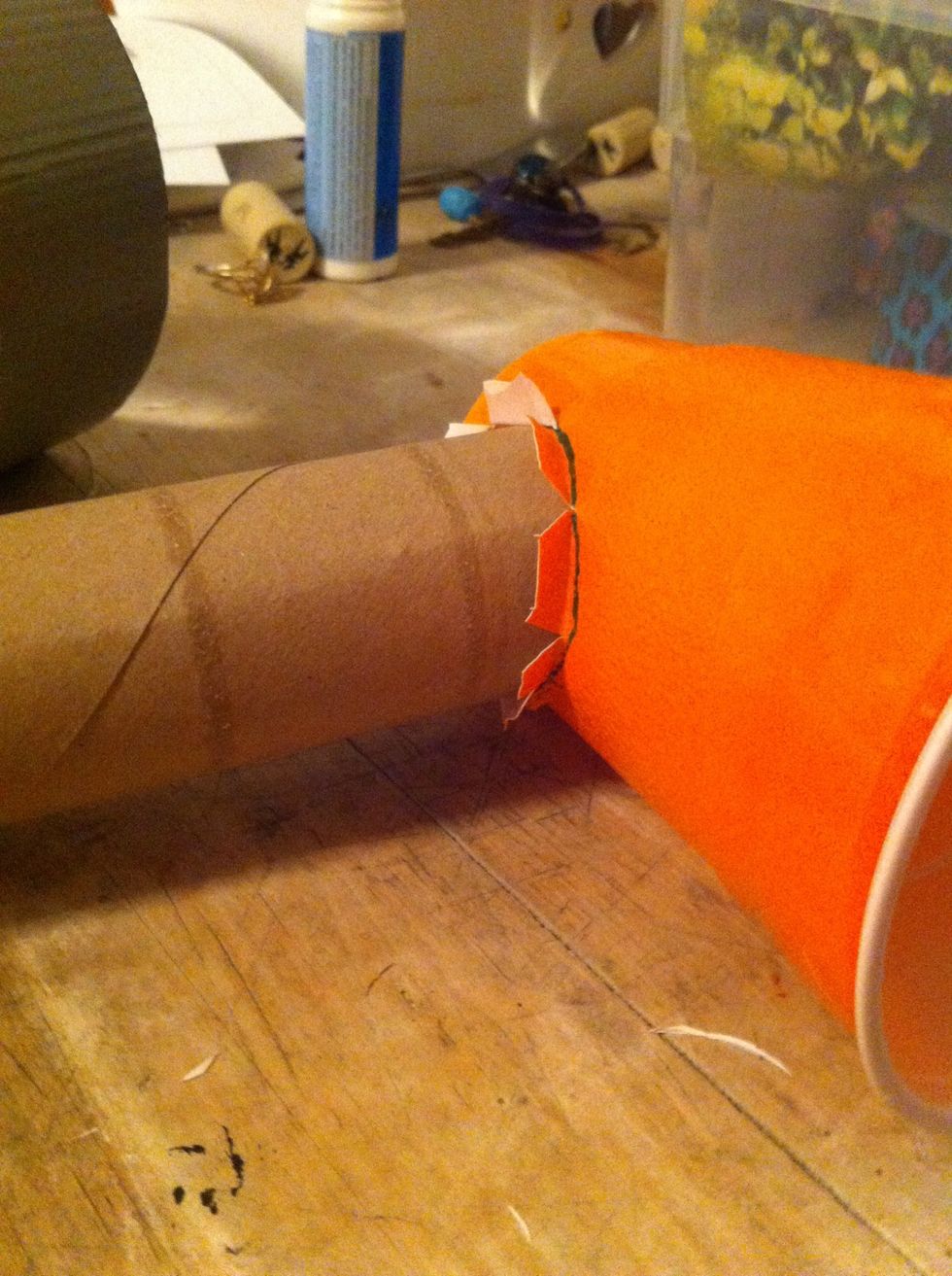 Don't that to both your cups and then slide them on the ends of your paper towels roll to make sure the home is big enough and make sure the flaps are I the outside