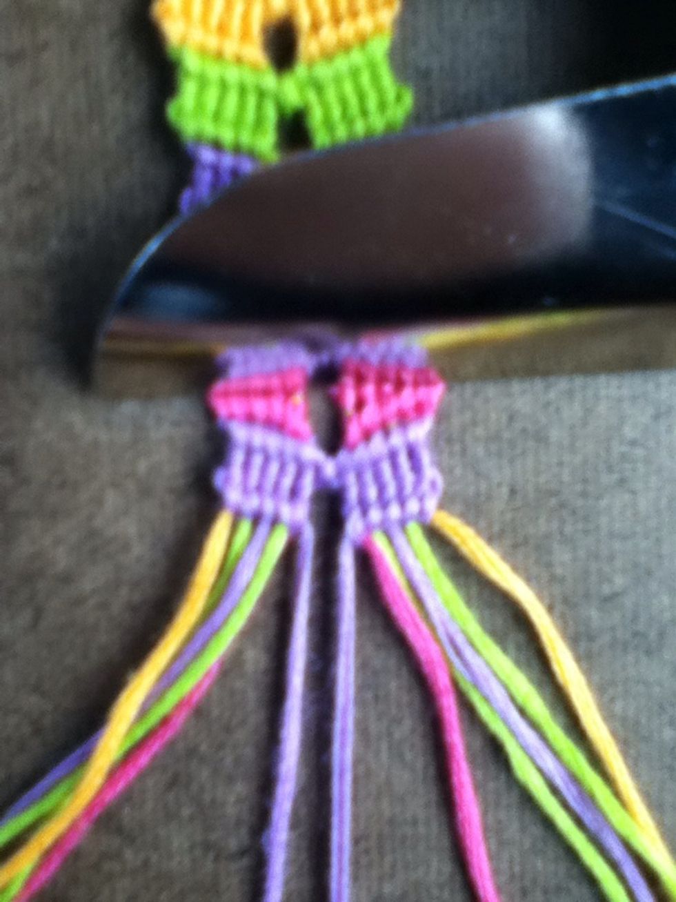 DON'T TIE THE CENTER STRINGS!!! It's the orange strings turn now.