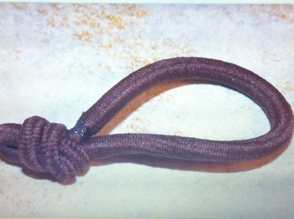 Don't want an arrangement, want a hair flower? Take a hair elastic and knot it. Push the rest of the elastic thru the center of a flower.