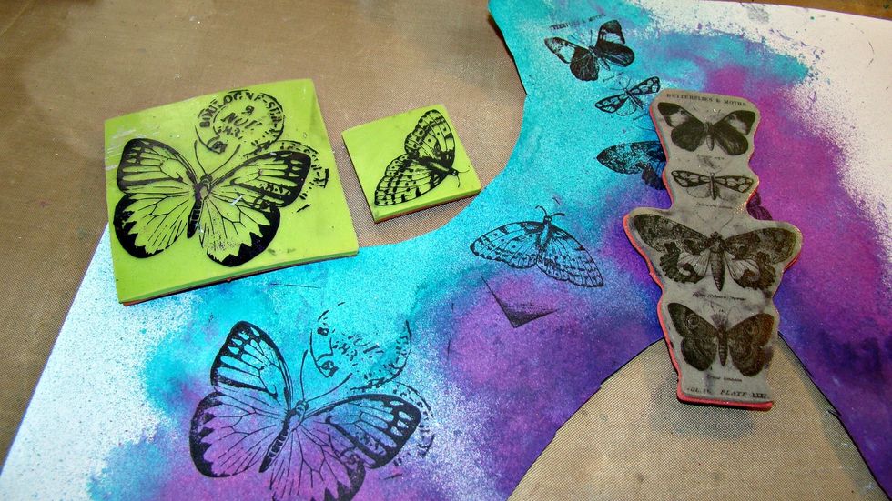 Don't waste that paper with all those pretty sprays, Let's stamp some more smaller butterflies and once dry cut them out and put aside.