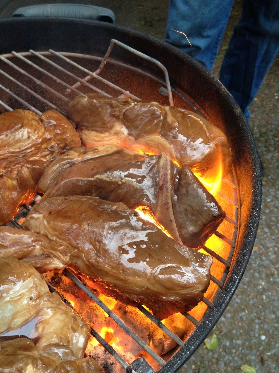 Don't worry about  a little flame up. That will give a good sear.  Depends on how hot the fire is for the sear. 1 to 2 minutes. Turn. Sear second side. 1 to 2 minutes on that side.