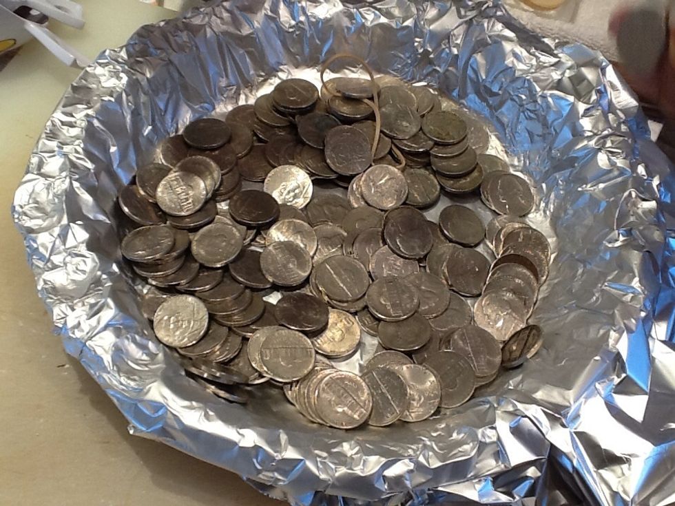 (Don't worry, the rubberband was taken out) bake for ten minutes on 400degree heat. Take it out, remove the foil &pie weights. bake again for 7 mins on 375degree heat. let it cool for about 8 mins.