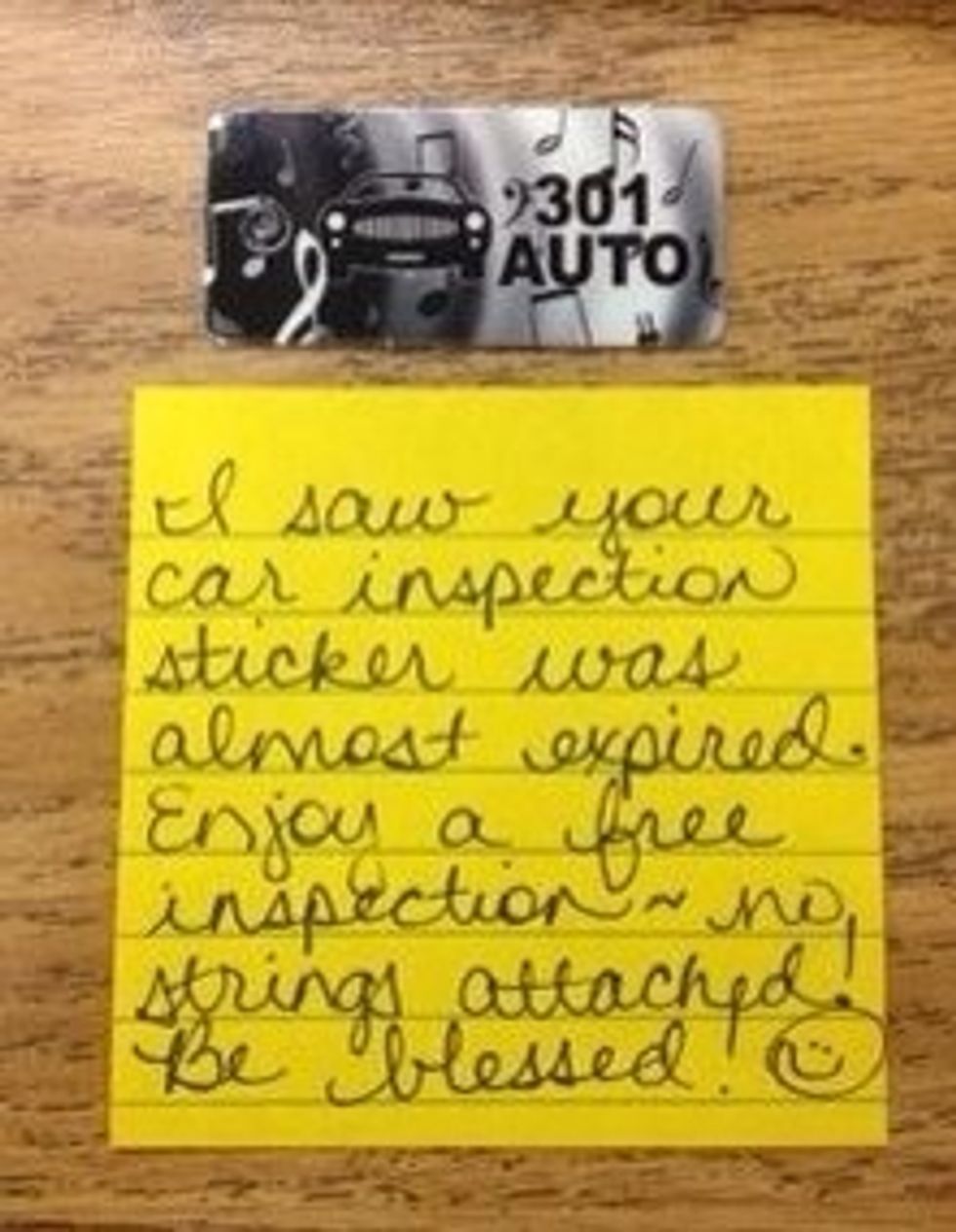 Donate a car inspection coupon card to a stranger.