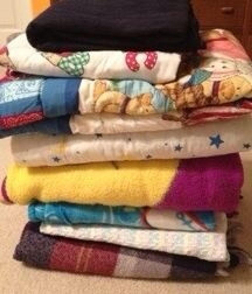 Donate blankets to a homeless shelter. Or an animal shelter. You'd be surprised how appreciative others are for simple comforts like a blanket.