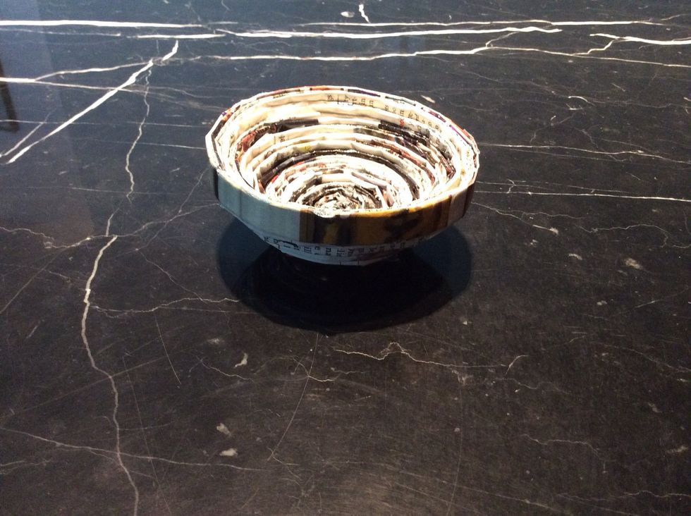 Done! The bigger your coil of magazine strips are, the bigger the bowl would be. This is the smaller one that I did. Apply a sealant if you want to ( I used Mod Podge )