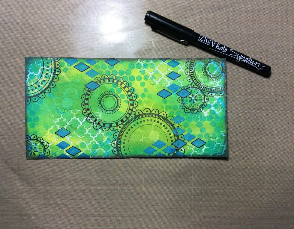 Doodle stamped images if desired using a permanent black pen.