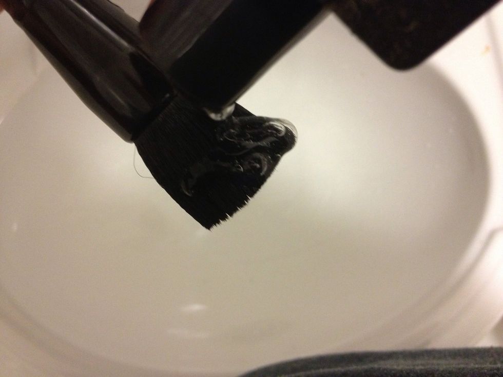 Dot some brush shampoo on it. I got this from e.l.f. for $3. You can also use baby shampoo. (Adult shampoo may be too harsh on some bristles.)