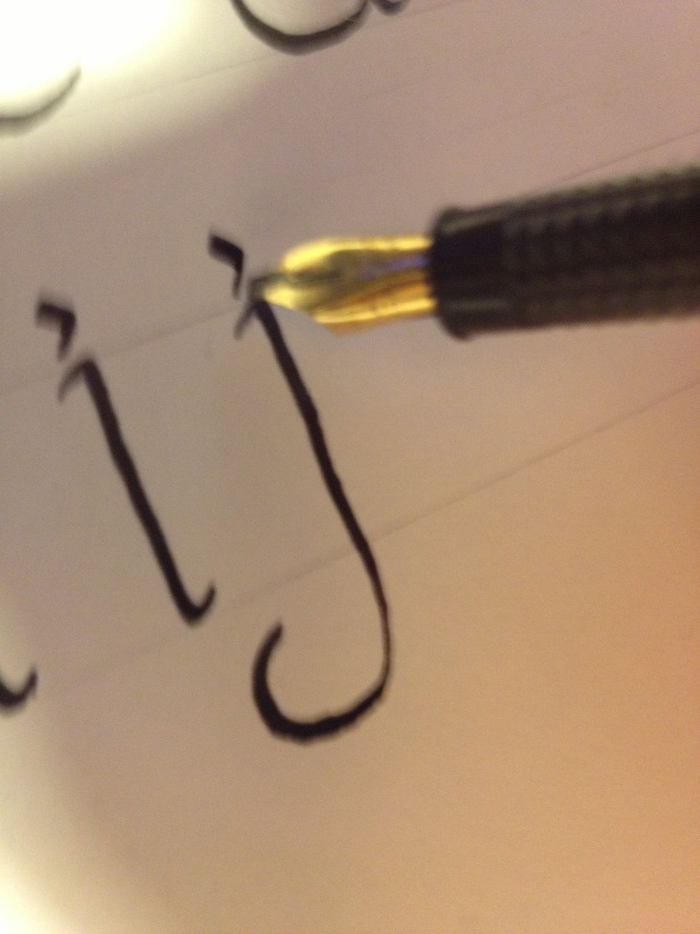 Dot the "j" the same way you would dot an "i".