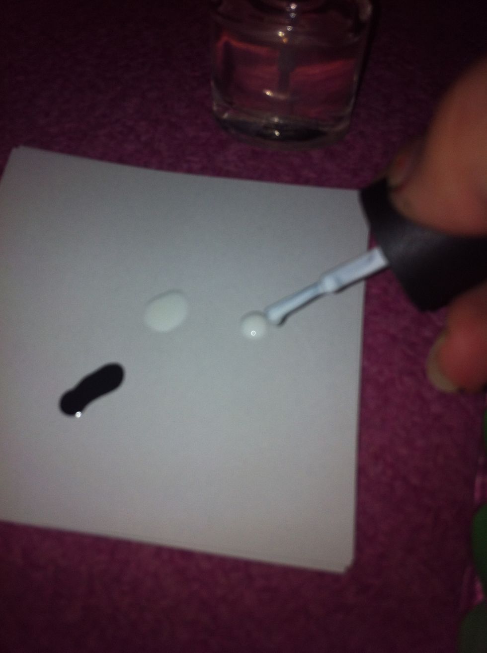 Dot the white polish again.