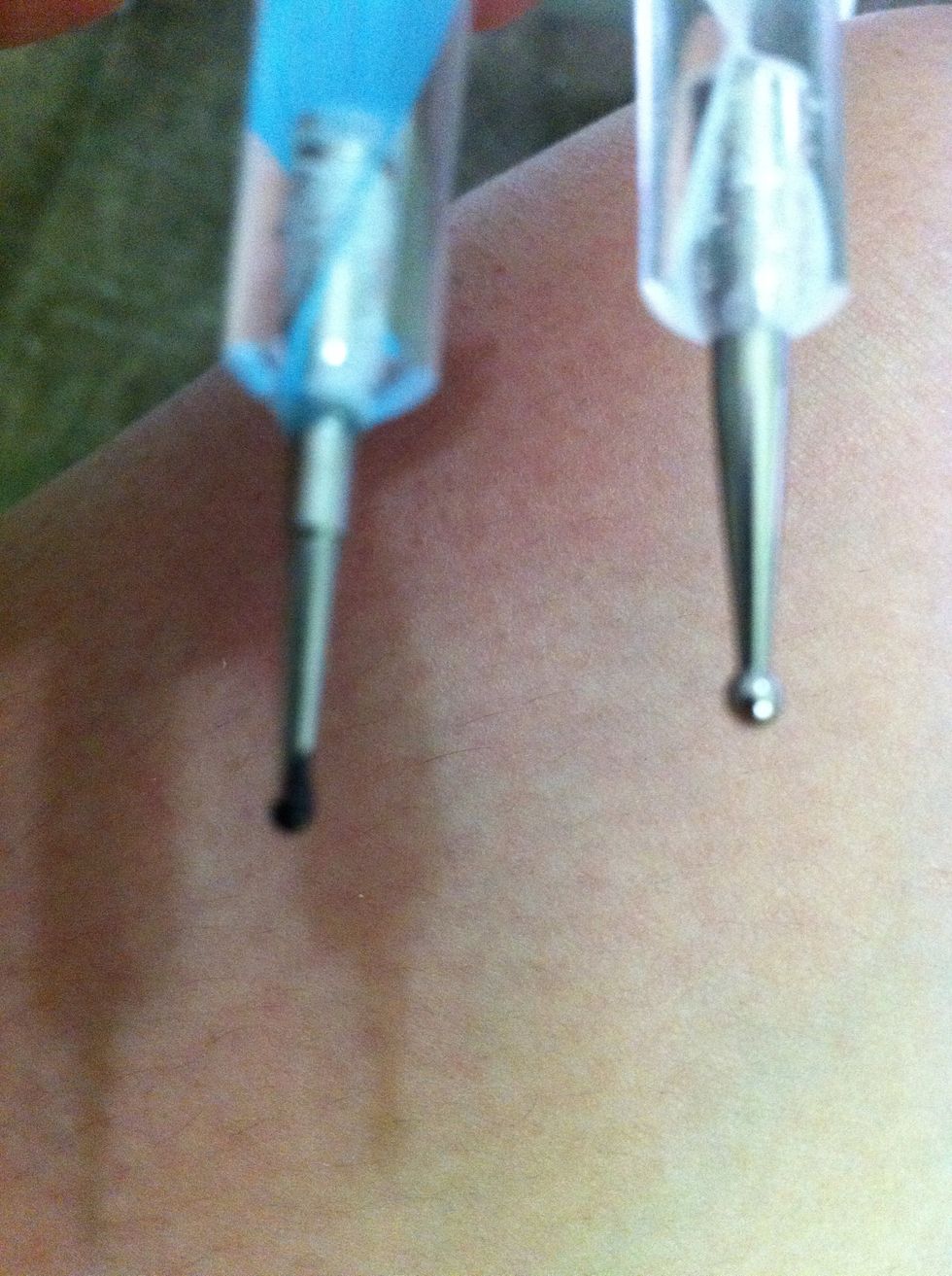 Dotter (u can buy these at any nail art salon) if u can find one u an use toothpick anyway :)