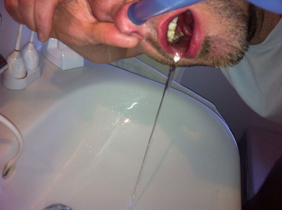 Double check nobody's watching. Let the rest of the water rinse your nose. Close the other nostril with your finger so the water comes out of your mouth. Repeat Steps 5 and 6 with the other nostril.