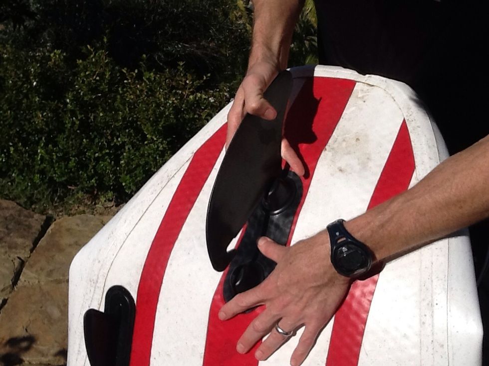 Double Fang - Step 2 - push down between the two knobs. The idea is to bring them closer together. So, you are essentially causing a crease/bend between the knobs.