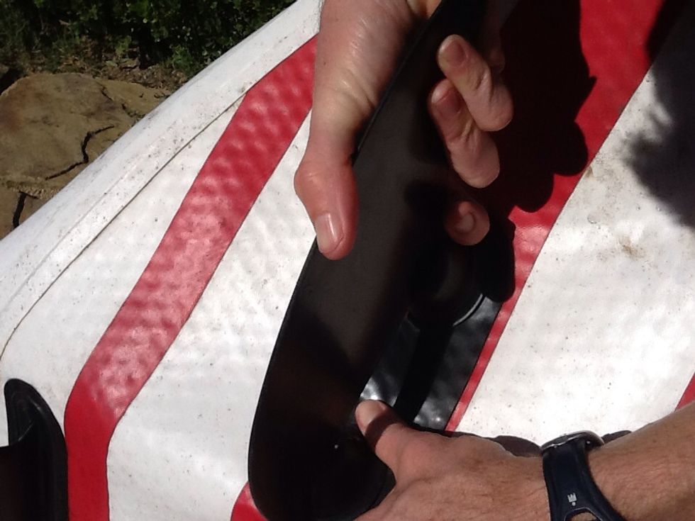 Double Fang - Step 3 - while the the knobs are closer together, catch the front fang onto the front knob. Make sure it catches, then release the board so that the knobs separate.