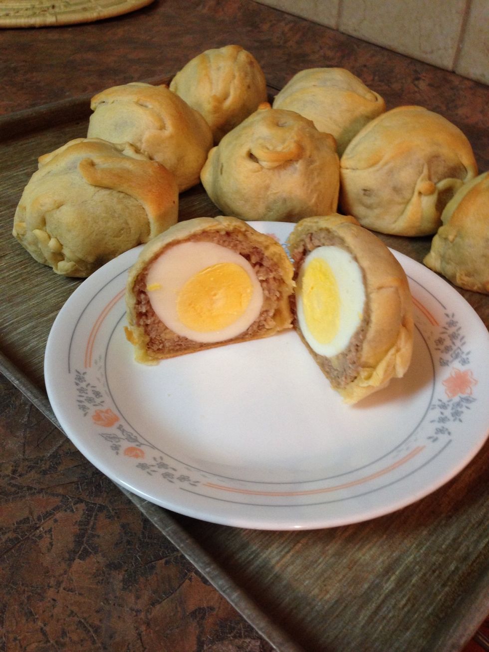 Dough bakes to a nice buttery tasty lightly crisp outside. Inside is savory browned pork and a hard boiled egg surprise inside!