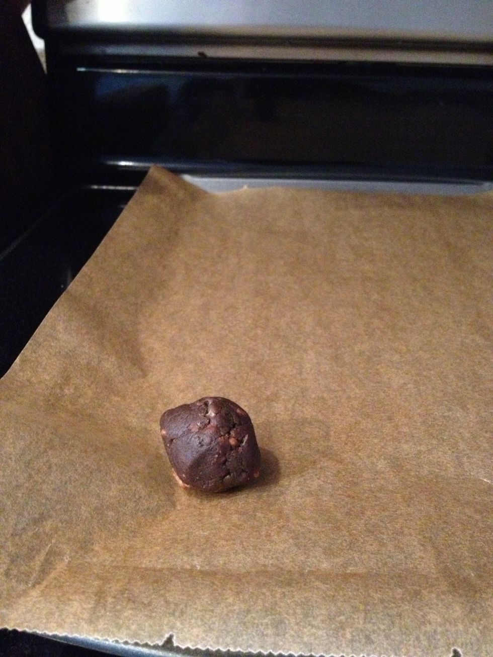Dough ball on parchment, ready to bake.