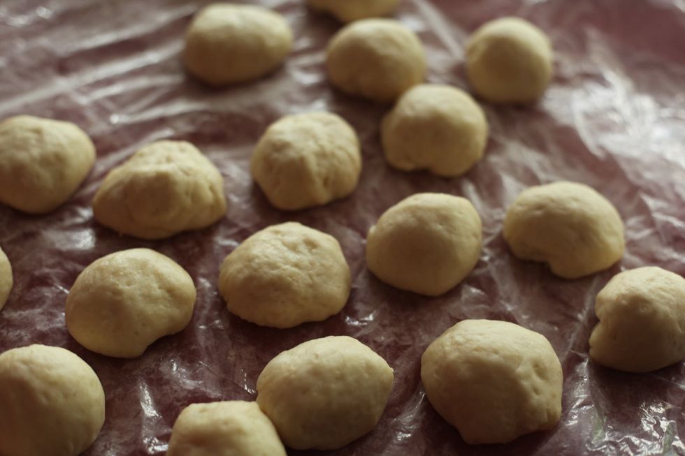 Dough ready? Cut it into palm sized balls. My palm size is quite big. Basically keep this in mind: 1 heaped tbsp of chocolate must fit inside the dough & that dough must fit in the cupcake cups.