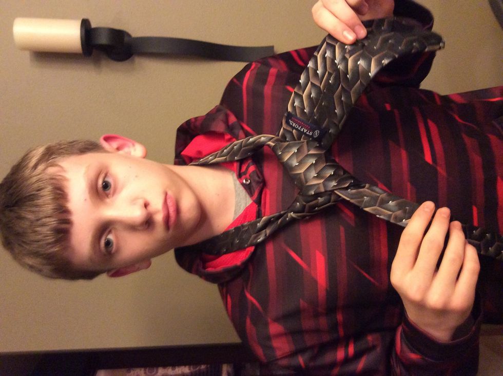 Down through neck loop and to the left