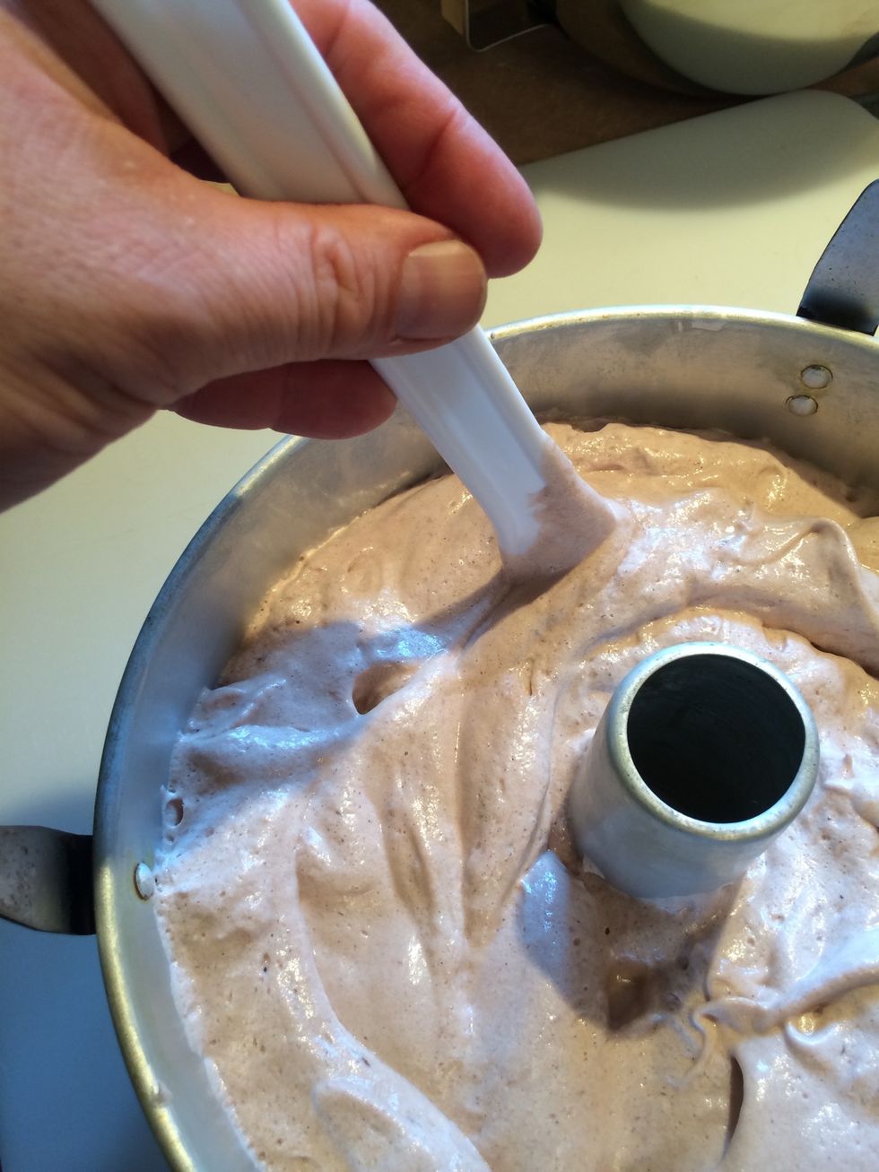 Drag a spatula through the cake batter to release any large pockets if air that could be trapped.