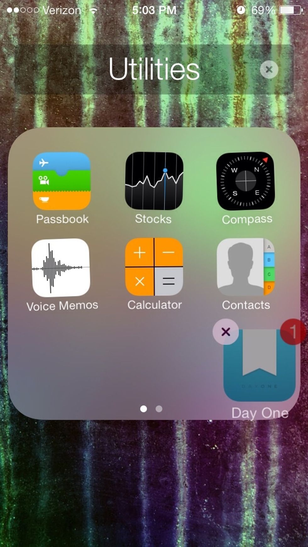 Drag the app that you want to hide into the folder as normal. However, drag it to the side to create a new page.