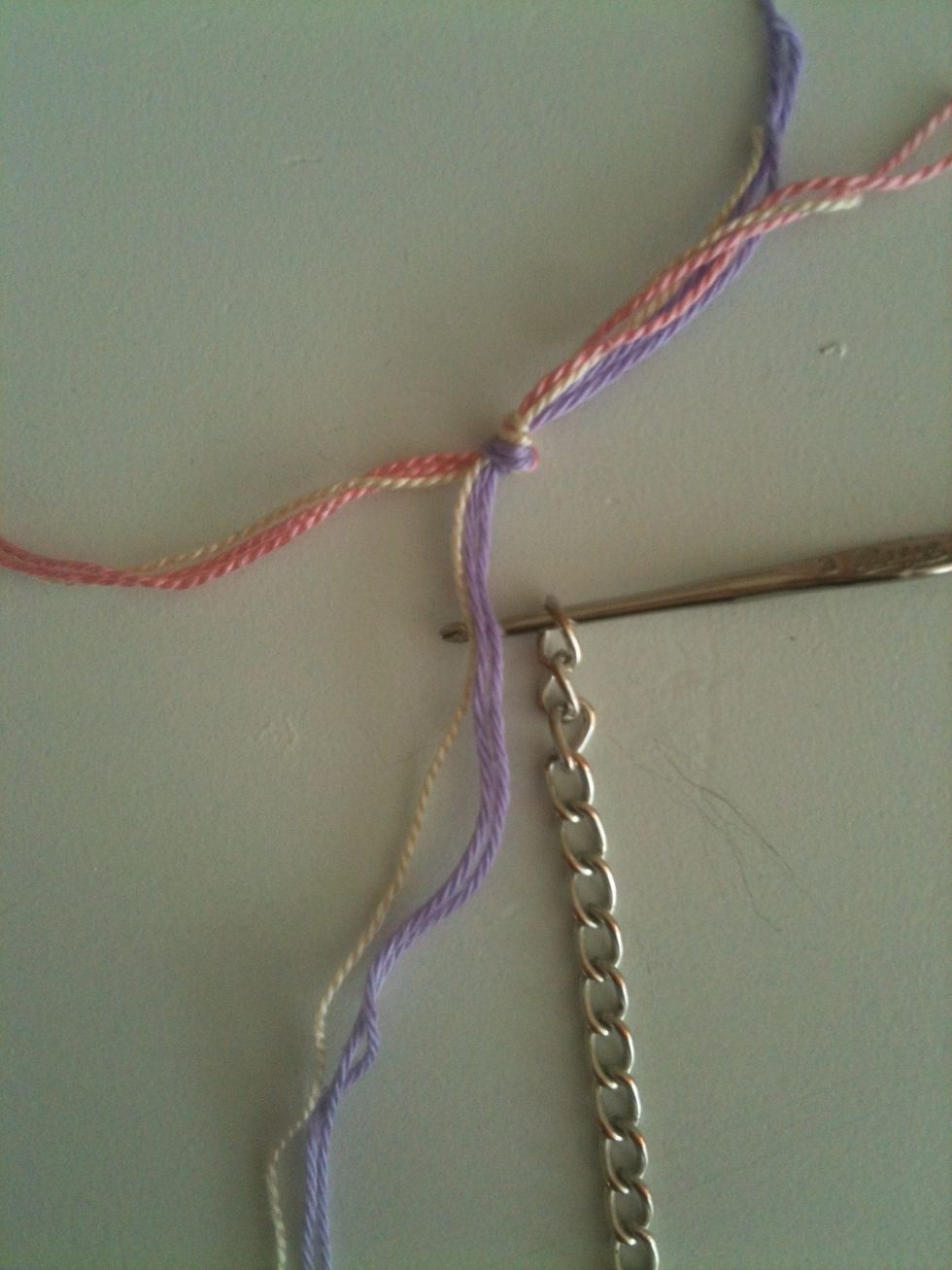 Drag the purple thread through the chain. It's important that you stick in the hook from above!