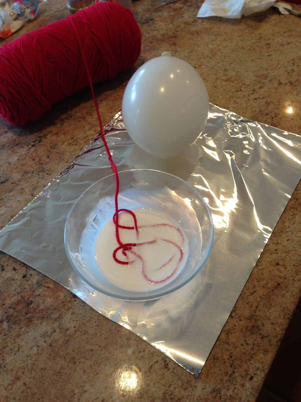 Drag yarn through mod podge.