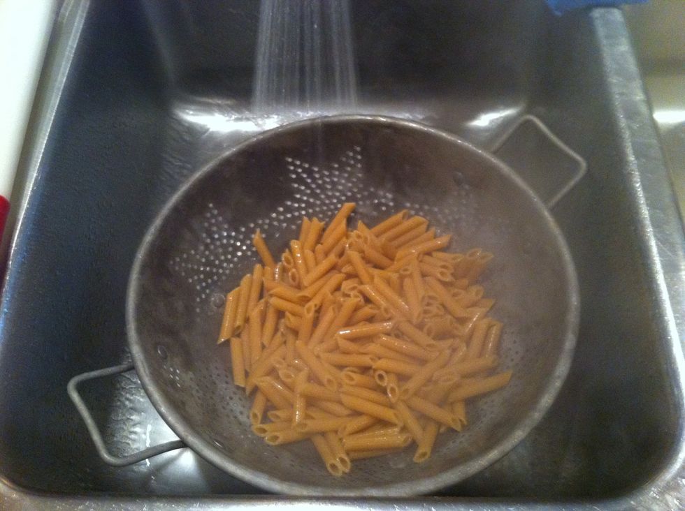 Drain cooked pasta.