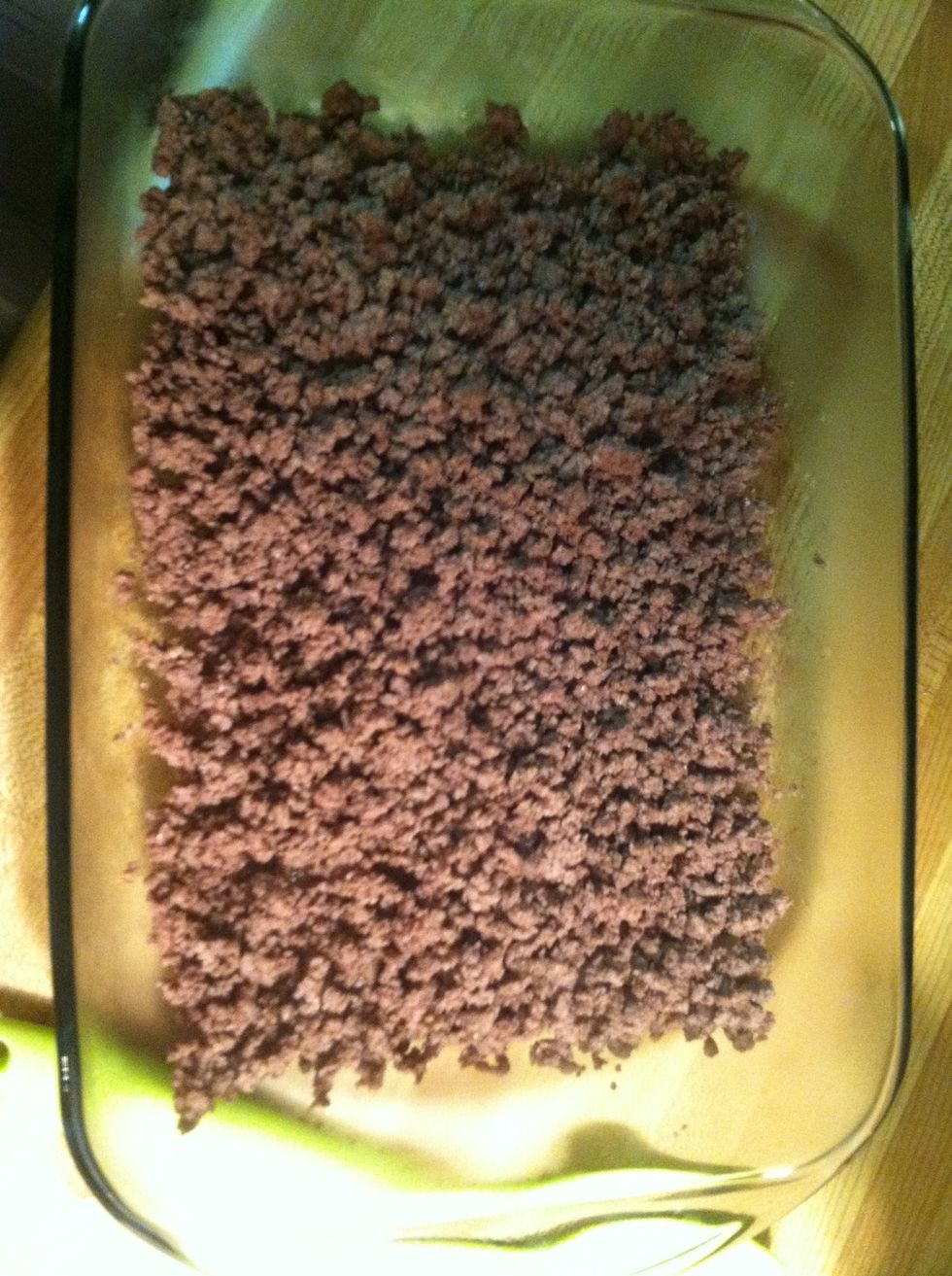 Drain ground beef of excess fat and layer in large baking dish. I am using a 13x9.