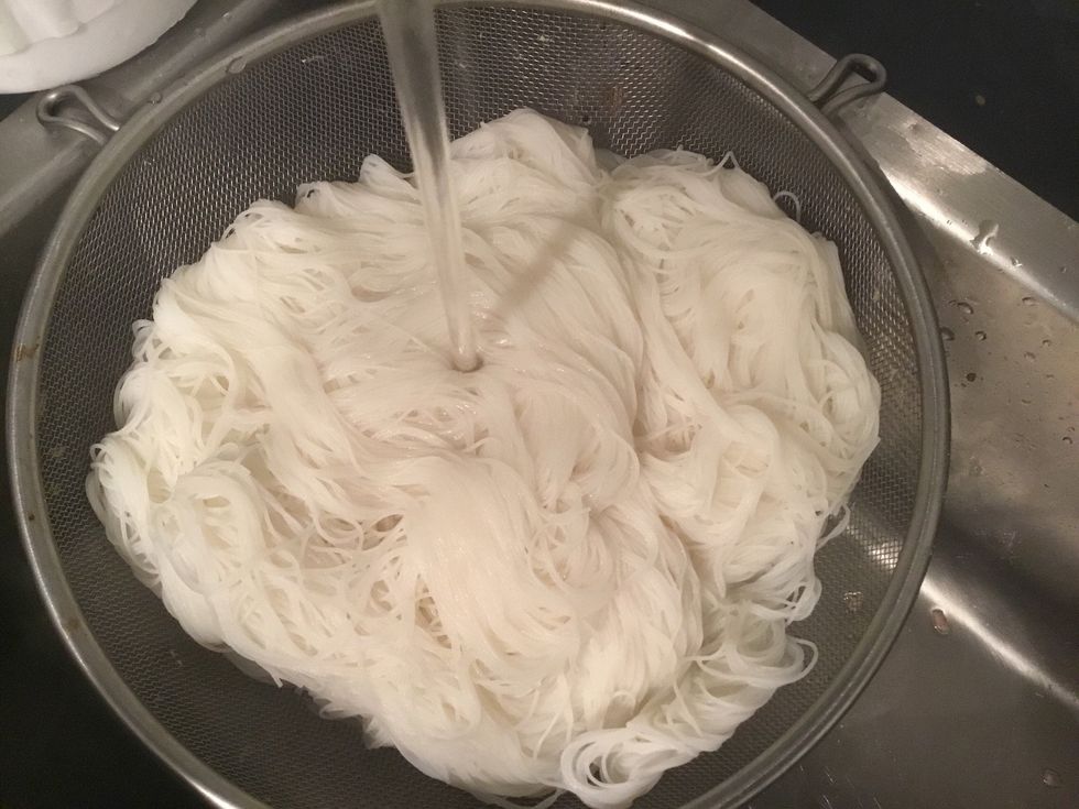 Drain hot water and rinse with cold water.