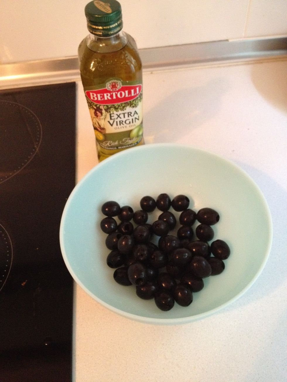 Drain it dry and add half the olive oil.