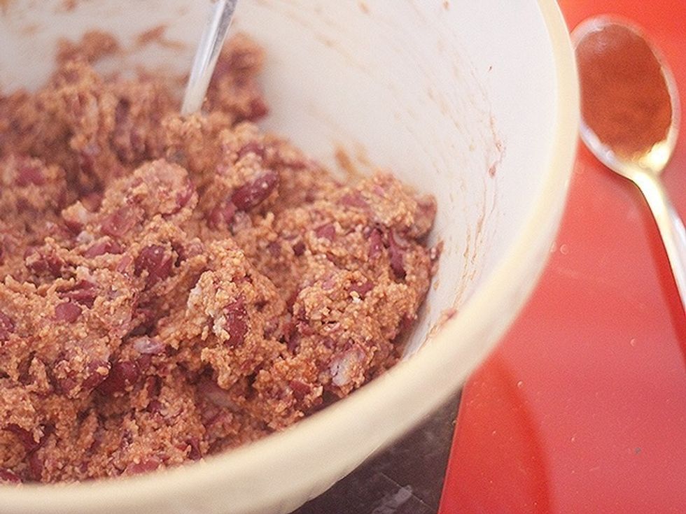 Drain kidney beans and put them in a large bowl. Partially mash them before adding the breadcrumbs, chilli powder, egg and ketchup