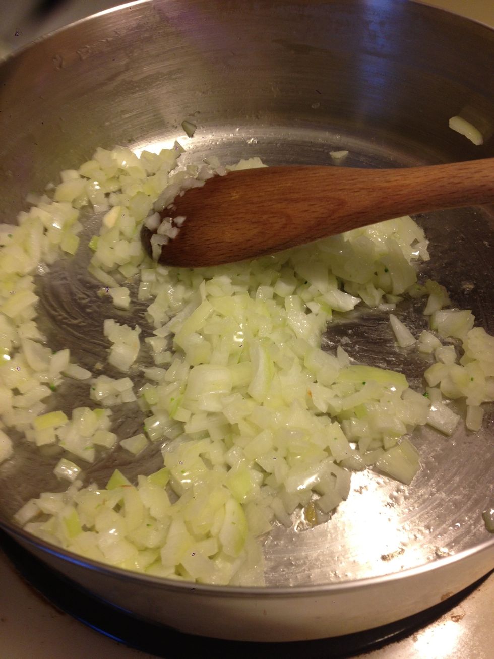 Drain macaroni and set aside. Heat 1TBSP of oil in skillet (I'm all about reducing dishes so, I used the same pot I boiled the mac in) add onions and saut\u00e9 for approx. 2 minutes or until translucent.
