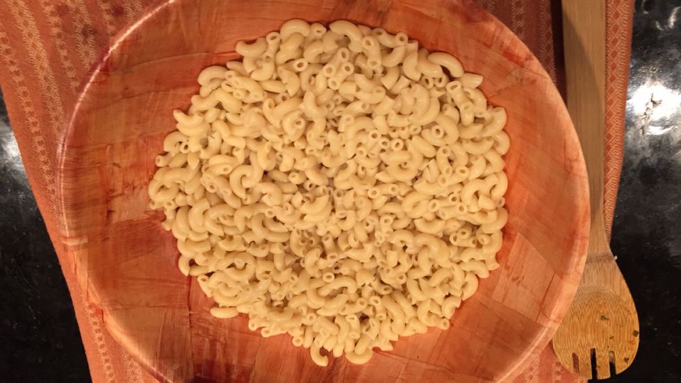 Drain macaroni then rinse macaroni with cold water.