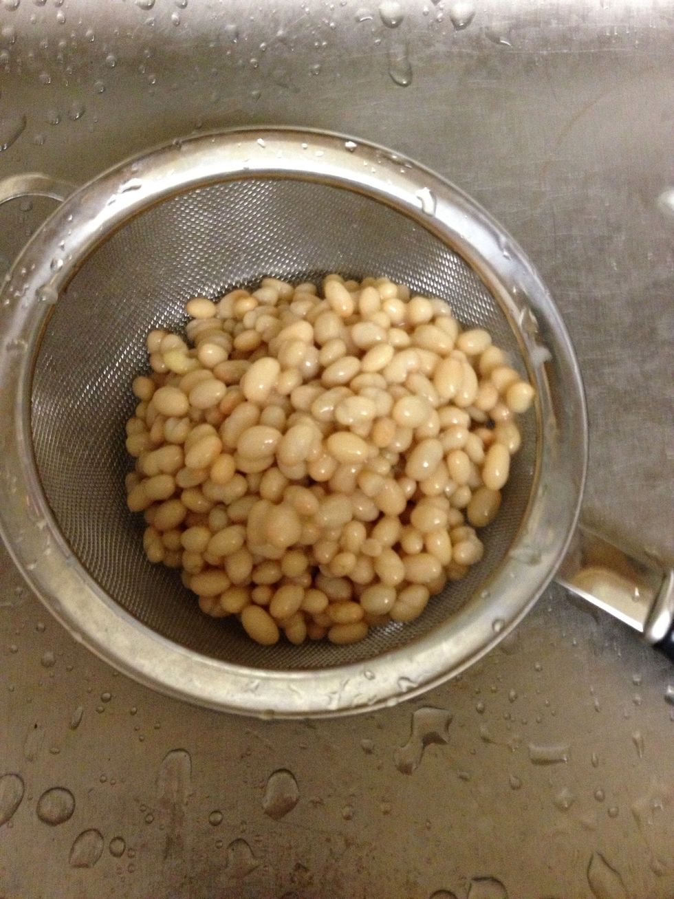 Drain one can of Goya white beans then rinse cold water through strainer.