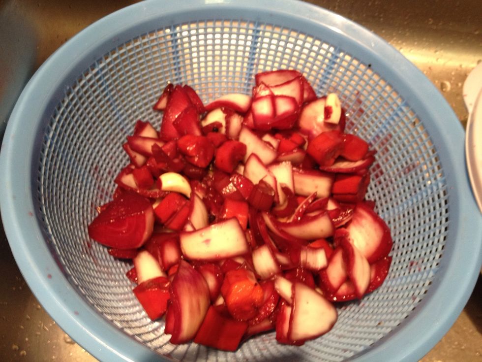 Drain our the solids from the marinade using a strainer. Don't get rid of the actual marinade liquid!