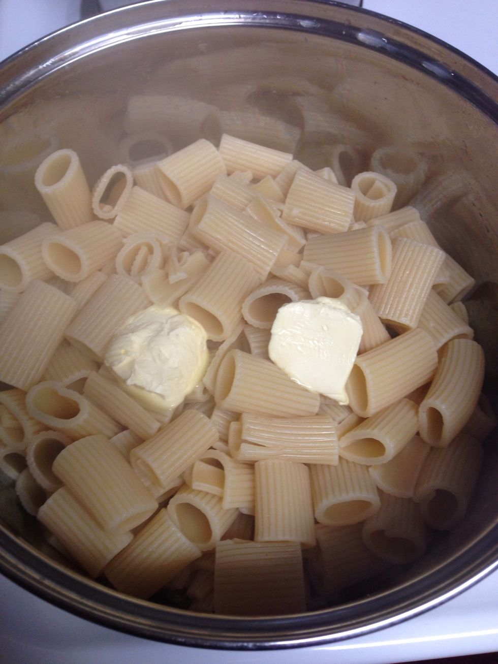 Drain pasta after it is tender. I added about 2 tablespoons of margarine to pasta. Stir until melted